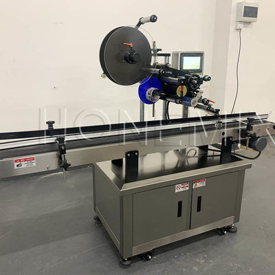 Top Plane Sticker Labeling Machine 2KW Disesuaikan untuk Botol Jar